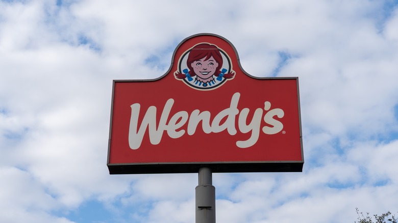 Wendy's tall road sign blue sky