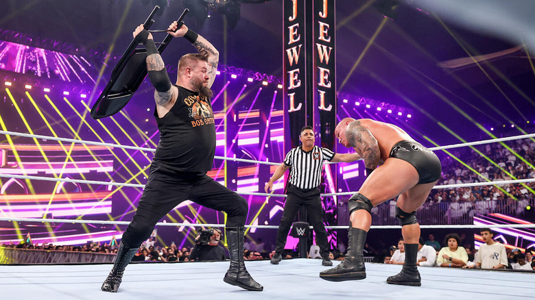 Kevin Owens hitting Randy Orton with a steel chair at WWE Crown Jewel